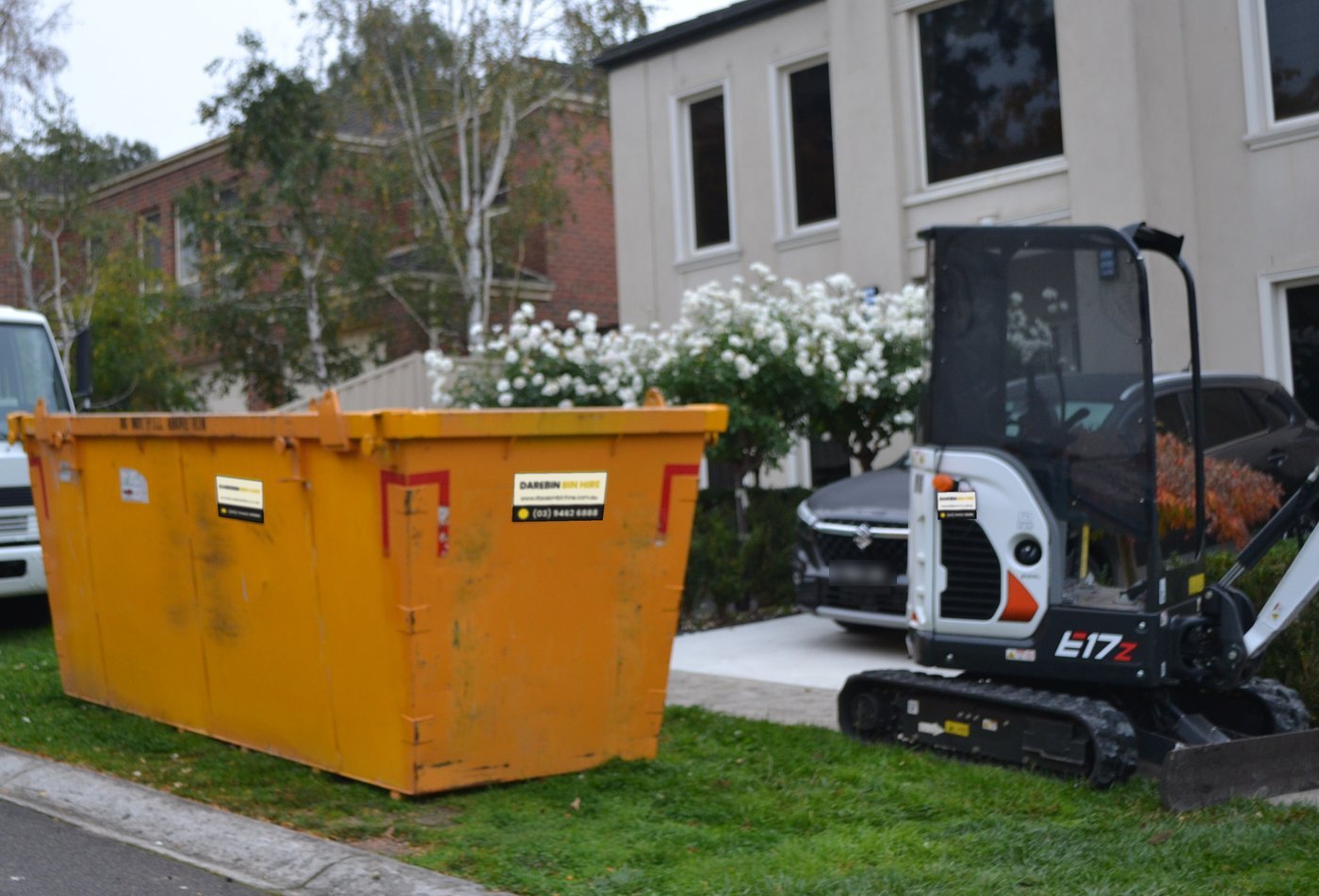 Darebin Bin Hire skip bin and mini excavator delivered together on a job in Melbourne's north